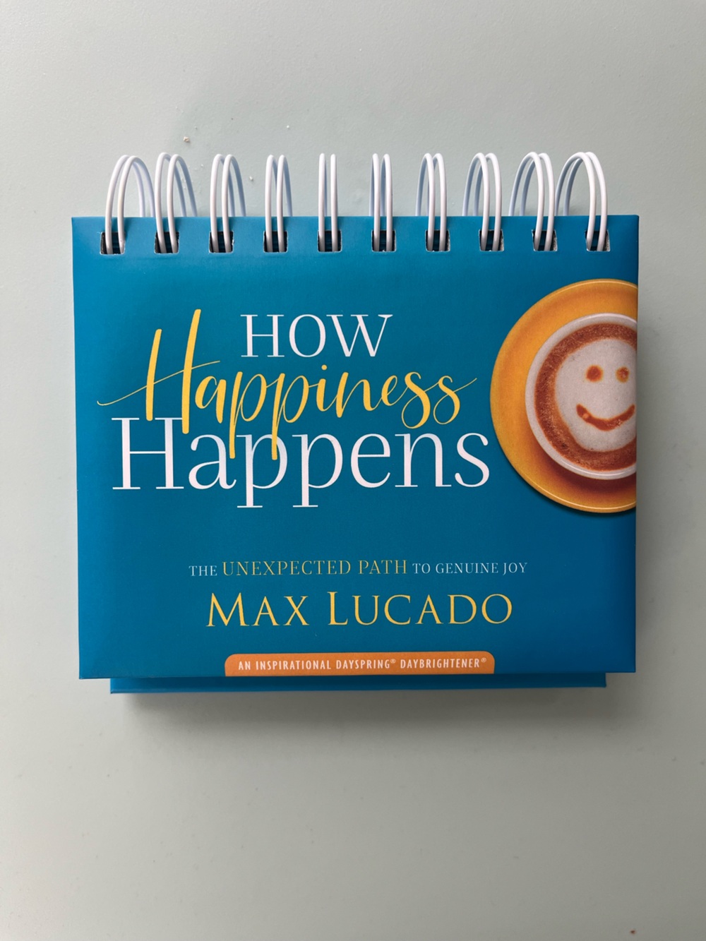 How Happiness Happens by Max Lucado - Teal & Yellow Desk Flip Book
